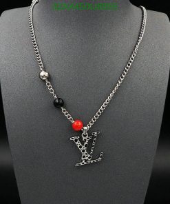 Silver chain necklace with black and red beads.