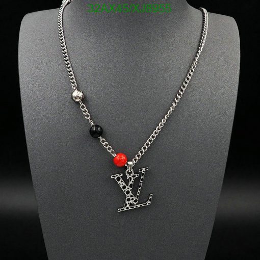 Silver chain necklace with black and red beads.