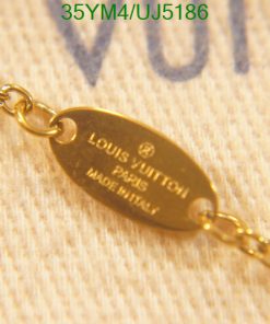 Gold Louis Vuitton chain detail on fabric