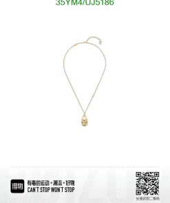 Gold pendant necklace with tiger head charm.