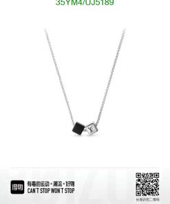 Silver pendant necklace with designer logo cube.