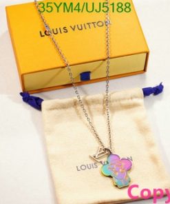 Louis Vuitton necklace with flower pendant on display.