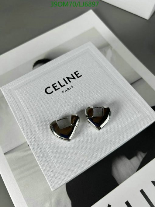 Designer silver heart-shaped earrings on display.