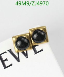 Gold square cufflinks with black centers on white background.