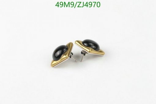 Gold and black oval cufflinks on white background.