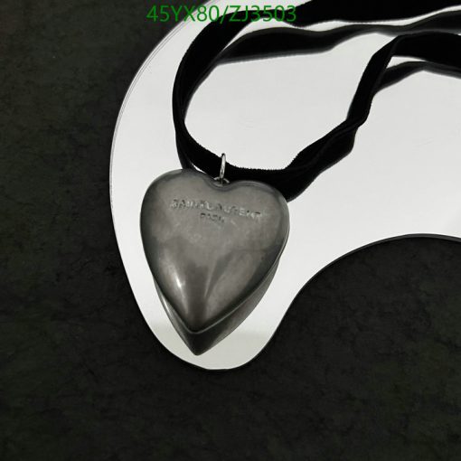 Silver heart pendant on black ribbon necklace