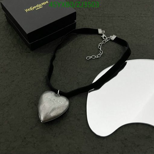 Silver heart pendant on black ribbon with box.