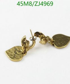 Gold charm bracelet with engraved pendants on white background.