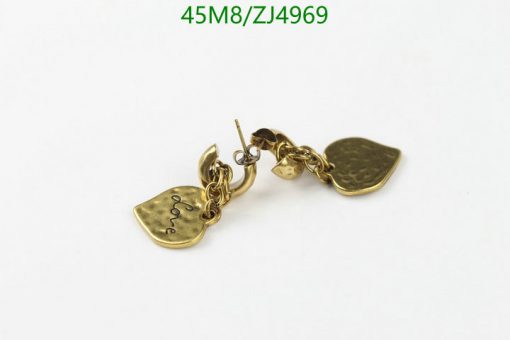 Gold charm bracelet with engraved pendants on white background.