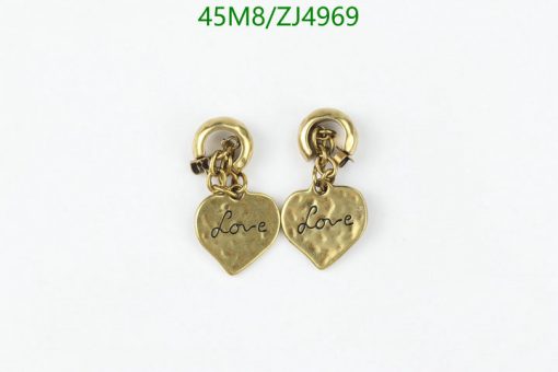 Gold heart-shaped "Love" inscribed earrings on white.