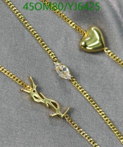 Gold necklaces with heart and Arabic script pendants.