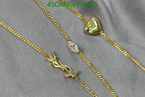 Gold necklaces with heart and Arabic script pendants.