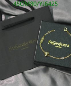 Designer bracelet in box with brand shopping bag.