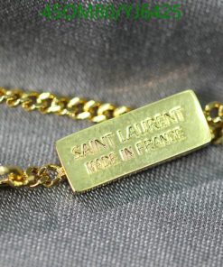 Gold Saint Laurent label on chain necklace.