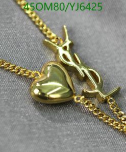 Gold heart pendant on chain with airplane charm.