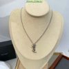 Elegant pendant necklace on display mannequin.