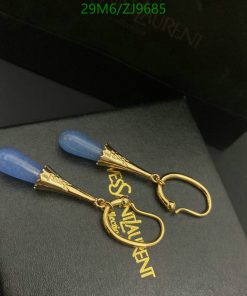 Designer gold earrings with blue stones.