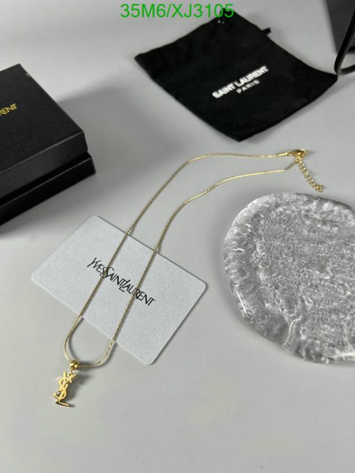 Gold necklace with logo pendant and elegant packaging.