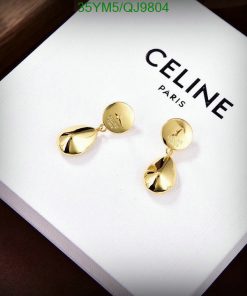 Gold drop earrings on white branded box.