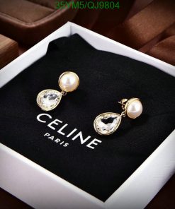 Elegant pearl and crystal drop earrings in display box.