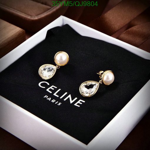 Elegant pearl and crystal drop earrings in display box.