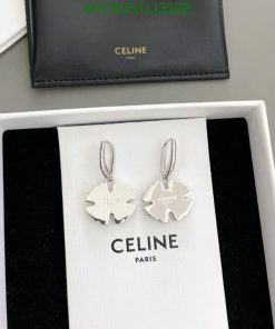 Celine brand silver earrings in box.