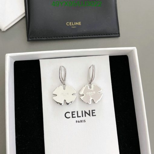 Celine brand silver earrings in box.