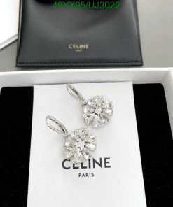 Celine diamond earrings displayed in open box.