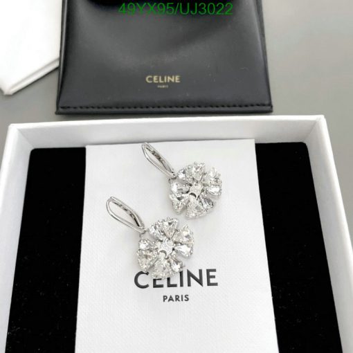 Celine diamond earrings displayed in open box.