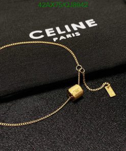 Celine Paris brand logo with gold necklace.