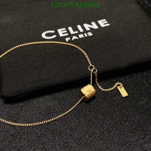 Celine Paris brand logo with gold necklace.