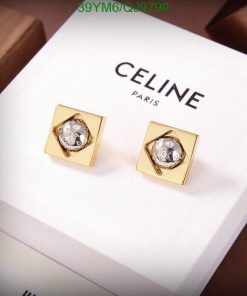 Celine gold square cufflinks on white display.