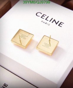 Gold Celine Paris square earrings on white background.