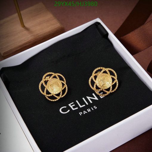 Gold Celine Paris logo earrings in box.