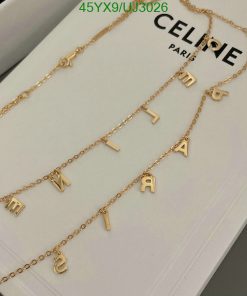 Gold letter pendant necklaces on display.