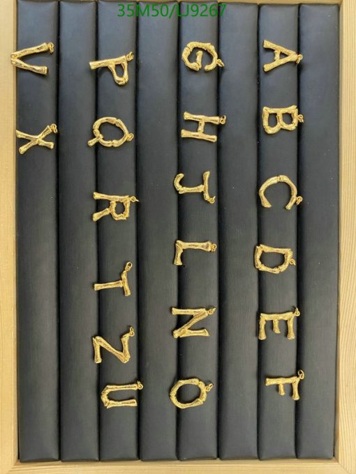 Gold letters arranged alphabetically on gray slats.