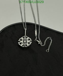 Silver tribal pendant necklace on black background