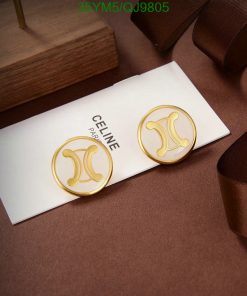Gold designer logo earrings on elegant brown backdrop.