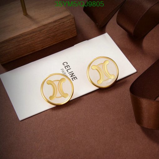 Gold designer logo earrings on elegant brown backdrop.
