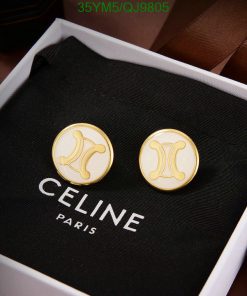 Designer cufflinks on branded black packaging.