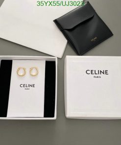 Celine gold hoop earrings with packaging.