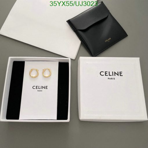 Celine gold hoop earrings with packaging.