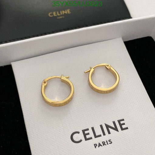 Gold Celine hoop earrings on display.