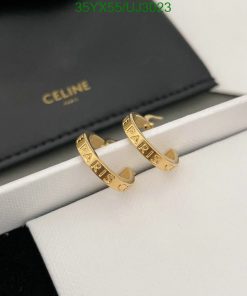 Celine gold rings with PARIS inscription on display