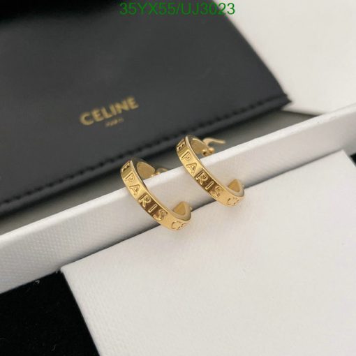 Celine gold rings with PARIS inscription on display