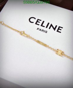 Gold bracelet on Celine Paris box.