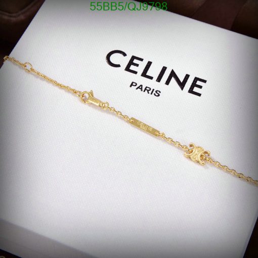 Gold bracelet on Celine Paris box.