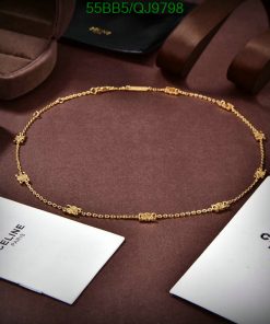 Elegant gold necklace on display with luxury branding.