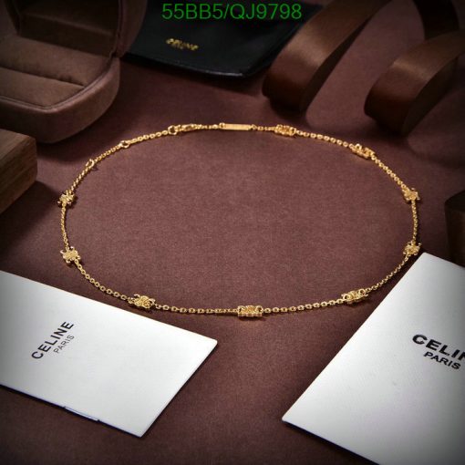 Elegant gold necklace on display with luxury branding.