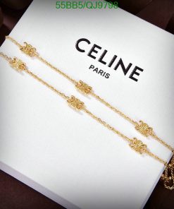 Gold bracelet with decorative elements on Celine Paris box.